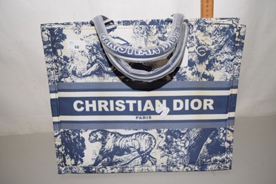 Lot 68 - A blue and white printed book tote bag, in...