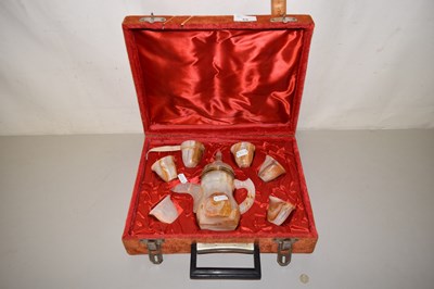 Lot 69 - An Arabian polished stone coffee set in...