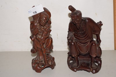 Lot 78 - A pair of 20th Century Oriental hardwood figures