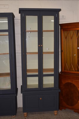 Lot 245 - A 20th Century painted two door display...