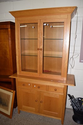 Lot 252 - Modern oak display cabinet with drawers and...