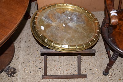 Lot 291 - Two brass trays and one folding stand (3)