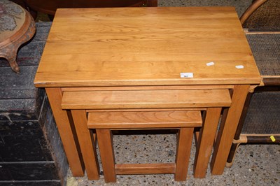 Lot 307 - A nest of three modern oak tables