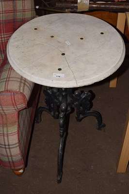 Lot 779 - Marble top with cast iron base table
