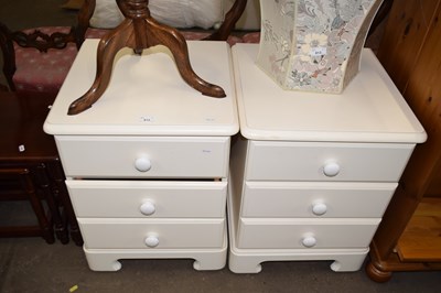 Lot 812 - Pair of cream painted bedside cabinets