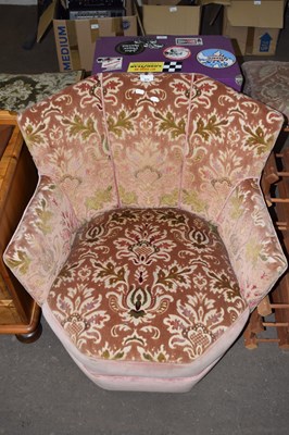 Lot 819 - A low upholstered tub chair