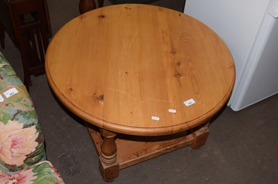 Lot 864 - A pine round coffee table