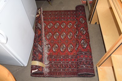 Lot 874 - Red ground rug