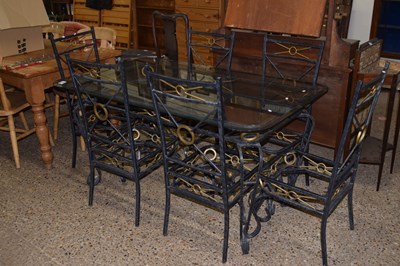 Lot 343 - A metal framed and glass topped dining table...