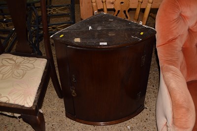 Lot 348 - A Georgian mahogany bow front corner cabinet