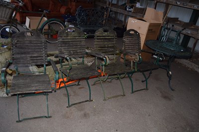 Lot 387 - A cast metal garden table with four...