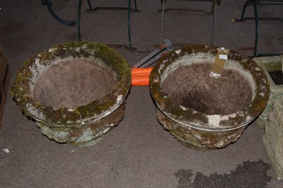 Lot 390 - A pair of circular concrete planters