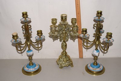 Lot 504 - A group of three gilt and enamel candle holders
