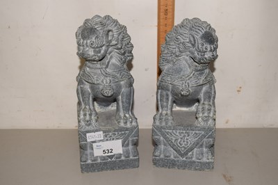 Lot 532 - A pair of reproduction stone foo dogs