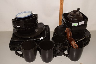 Lot 535 - A group of black ceramic dinner wares together...