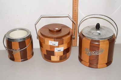 Lot 560 - A trio of wooden biscuit barrels together with...
