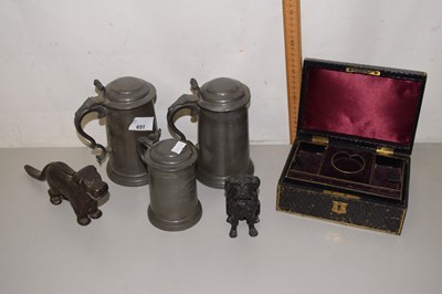 Lot 651 - A collection of pewter wares, dog nut crackers...