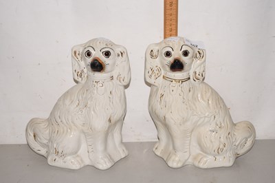 Lot 652 - A pair of reproduction Staffordshire dogs