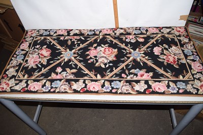 Lot 697 - A small Chinese made woollen floor rug