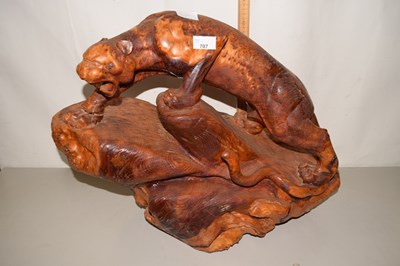 Lot 707 - A large wooden model of a Jaguar on rock with...