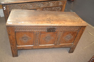 Lot 483 - An 18th Century oak coffer with carved three...