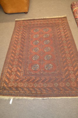 Lot 489 - A 20th Century Afghan wool floor rug decorated...