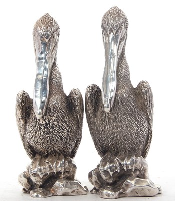 Lot 201 - A pair of 925 stamped "Pelican" table...