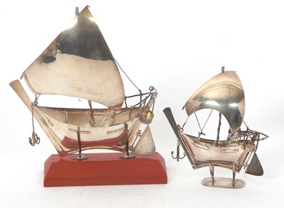 Lot 202 - A large 925 Dohan sale boat on a wooden plinth...