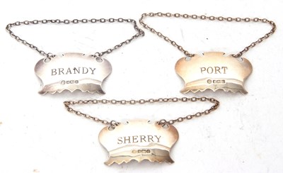 Lot 203 - A group of three hallmarked silver decanter...