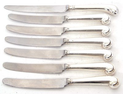 Lot 213 - A group of six silver pistol handled tea...