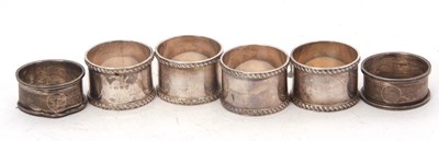 Lot 223 - A cased set of four George V silver napkin...