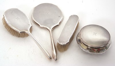Lot 230 - Four piece silver mounted dressing table wares,...