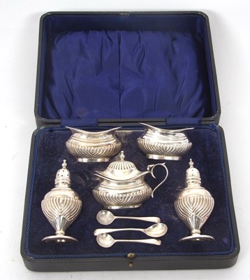 Lot 241 - A cased George V silver five piece condiment...
