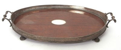 Lot 250 - A large silver plated and oak gallery twin...