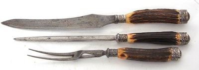 Lot 255 - An antique three piece carving set, each with...