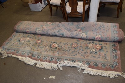 Lot 755 - A large pink ground carpet