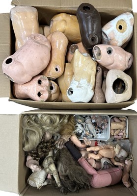 Lot 354 - Two large boxes of doll parts, to include...