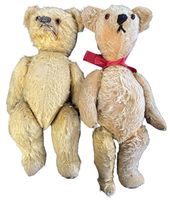 Lot 390 - A pair of well-loved vintage teddy bears. Both...