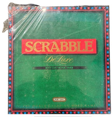 Lot 301 - A sealed Scrabble Deluxe Board Game with...