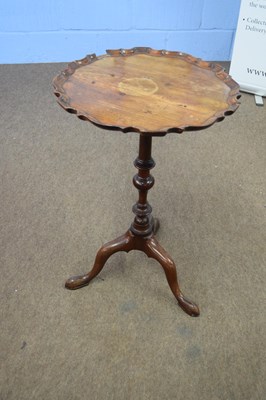 Lot 276 - Small mahogany wine table with shaped top over...