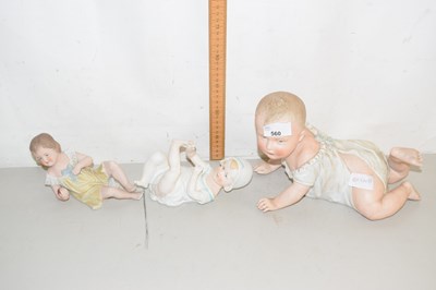 Lot 560 - Three porcelain models of babies