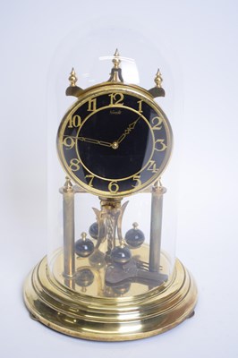 Lot 380 - Kundo brass torsion or anniversary clock set...