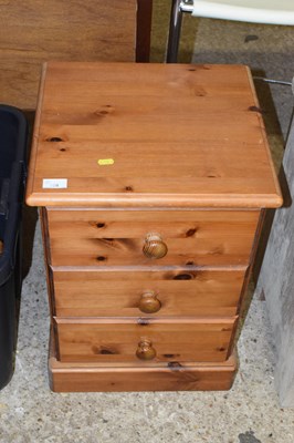 Lot 329 - Pine three drawer bedside cabinet