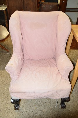 Lot 334 - Georgian style wing back armchair on balland...