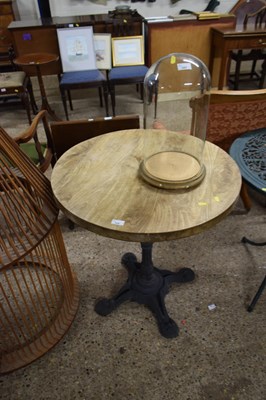 Lot 324 - Cast iron based pub table with circular wooden...