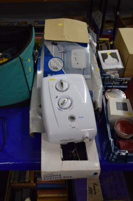 Lot 610 - A Triton electric shower and shower curtains