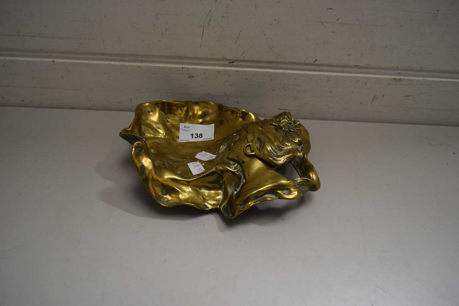 Lot 138 - CAST BRASS INKWELL AND DESK STAND FORMED AS A...