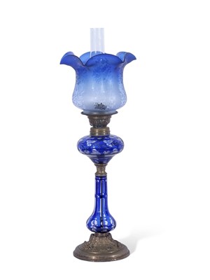 Lot 18 - Late 19th century oil lamp, the blue glass...