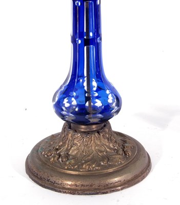 Lot 18 - Late 19th century oil lamp, the blue glass...