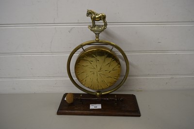 Lot 65 - SMALL BRASS DINNER GONG ON STAND